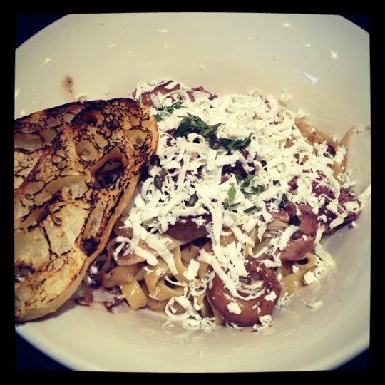 Red wine braised rabbit with tagliatelle mushrooms shaved ricotta salata and thyme.