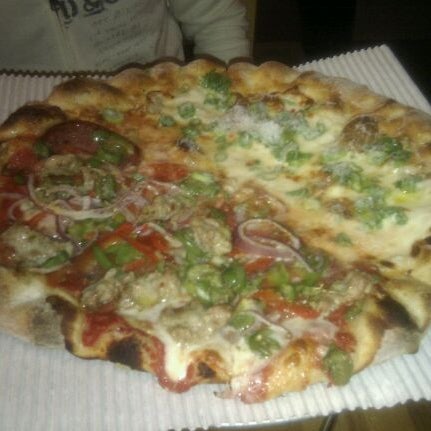 Photo taken at Howie&#39;s Artisan Pizza by Masato K. on 3/11/2012