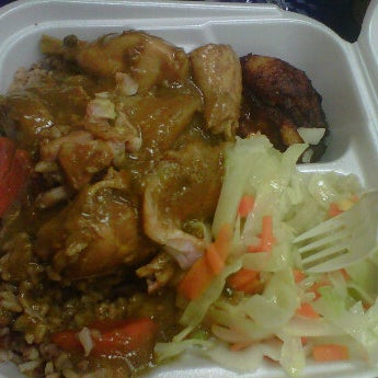 Photo taken at Golden Krust Caribbean Restaurant by VondaB on 4/18/2012