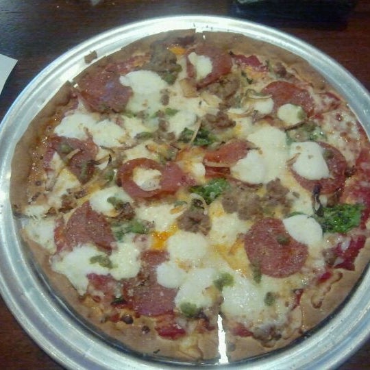 Photo taken at Top It Pizza by Dominique E. on 5/18/2012