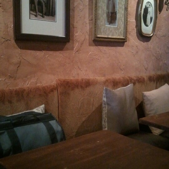 Photo taken at Ottimista Enoteca-Café by Chris S. on 7/5/2012