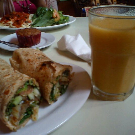 Photo taken at Greens Plant Based Restaurant and Café by Rosey F. on 2/14/2012