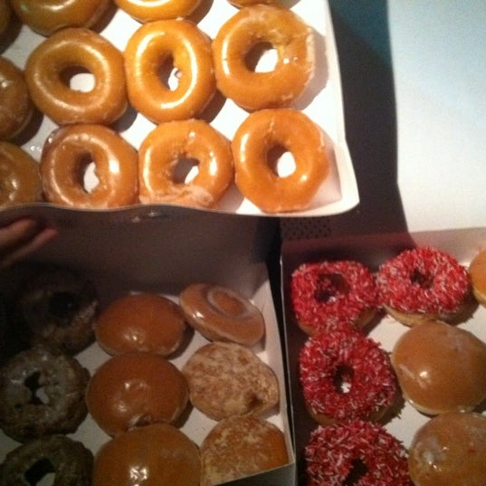 Photo taken at Krispy Kreme Doughnuts by Hayley H. on 2/20/2012