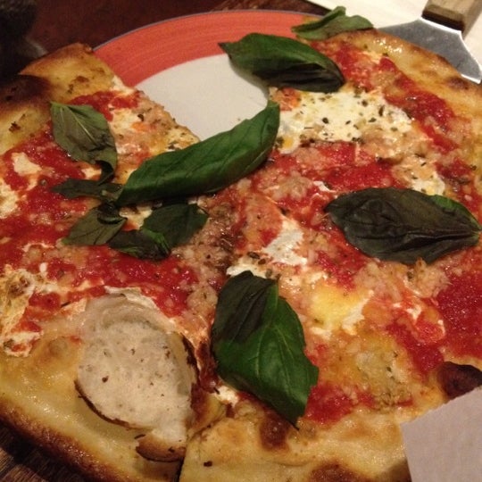 Photo taken at Plum Pizzeria &amp; Bar by Mickey L. on 3/23/2012