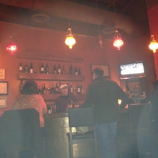 Photo taken at Uncorked Wine Bar &amp; Bistro by Andrew B. on 2/15/2012