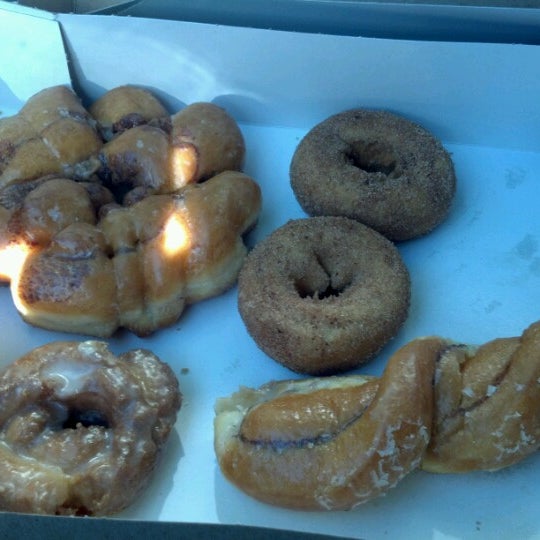 Photo taken at Cops &amp; Doughnuts Bakery by Tina L. on 7/1/2012