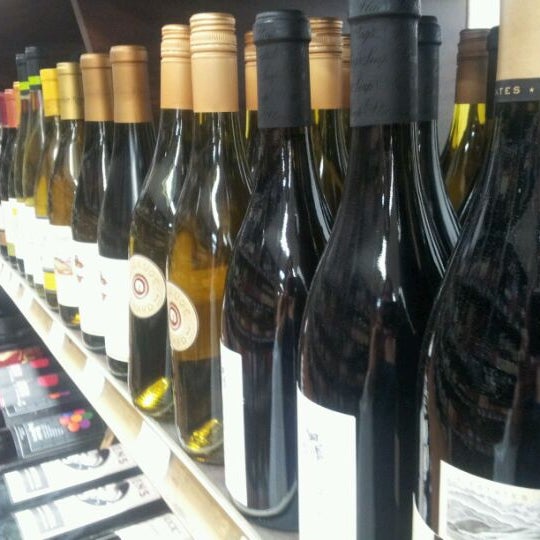 Photo taken at Grand Wine &amp; Liquors by Meaghan H. on 5/28/2012