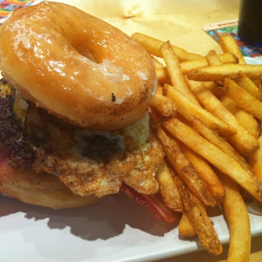 Photo taken at Crave Real Burgers by Brandon D. on 3/2/2012
