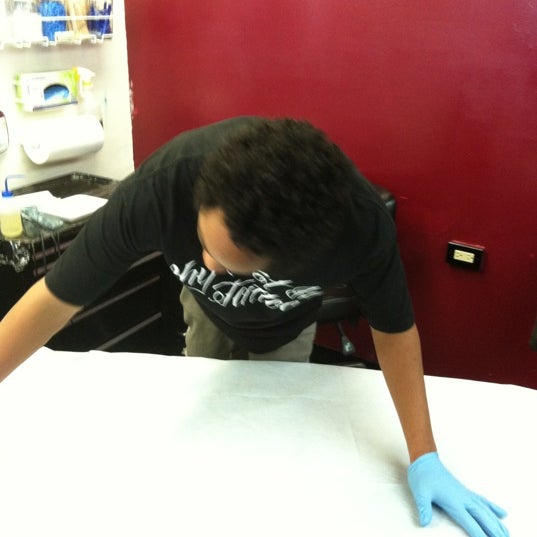 Photo taken at Why Not Ink Tattoo by John C. on 5/9/2012