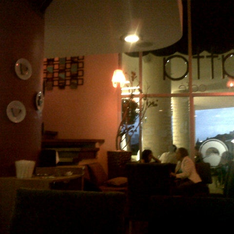 Photo taken at Seratta Café by Mac G. on 8/1/2012