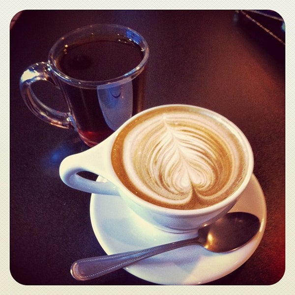 Photo taken at Volta Coffee, Tea &amp; Chocolate by Jac C. on 7/24/2012