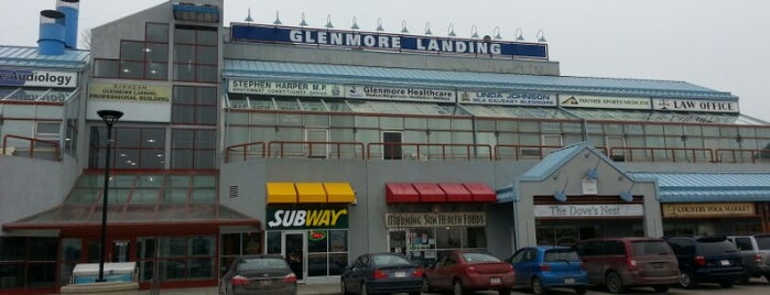 Glenmore Landing Shopping Centre is one of Locais curtidos por John.