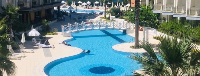 Ramada Hotel & Suites Kuşadası is one of Tempat yang Disukai Serbay.