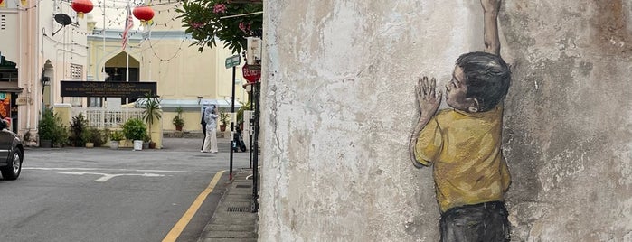 Penang Street Art : Boy on Chair is one of Penang Art.