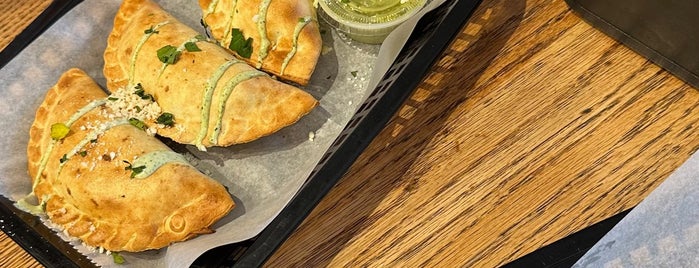 The Empanada Cookhouse is one of Eats.