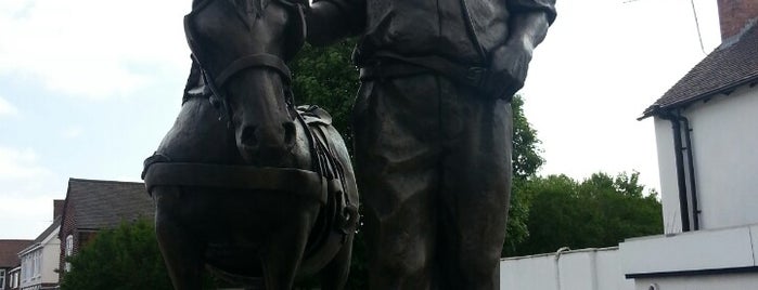 Scamp and Miner Statue is one of Local.