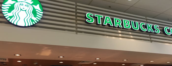 Starbucks US Departures is one of Lugares favoritos de Elizabeth.