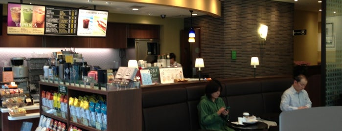 Tully's Coffee is one of สถานที่ที่ J. ถูกใจ.