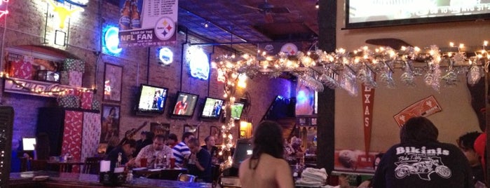 Bikinis Sports Bar & Grill is one of Dennis’s Liked Places.