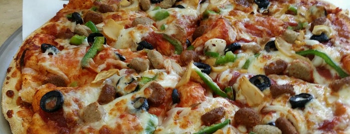 Domino's Pizza is one of Places I like in Cairo.