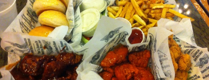 Wingstop is one of Heinie Brian’s Liked Places.