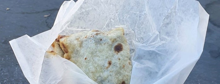 Shandra's Roti Shop is one of Places to try.