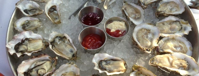 Hank's Oyster Bar is one of Top 10 for Raw Oysters.