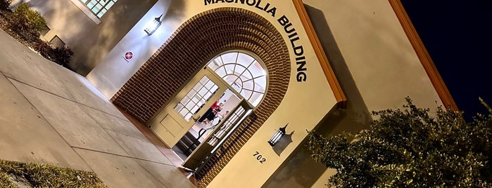 Magnolia Building is one of Places.