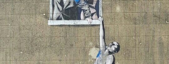 Banksy's "Well-Hung Lover" is one of Someday... Abroad.
