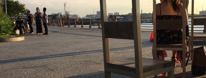 Two Too Large Tables - Hudson River Park is one of NYC Monuments & Parks.