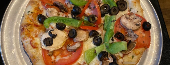 Zeeks Pizza is one of Lugares favoritos de Jacquie.