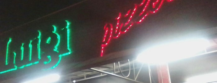 Luigi Pizzaria is one of Em Campo Grande.