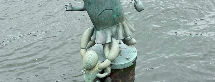 Tom Otterness - The Marriage Of Money And Real Estate is one of 111 Places NYC.