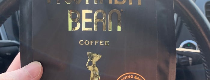 Rwanda Bean Roastery + Espresso Bar is one of Mike'nin Beğendiği Mekanlar.