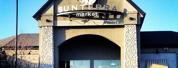 Sunterra Market is one of John : понравившиеся места.
