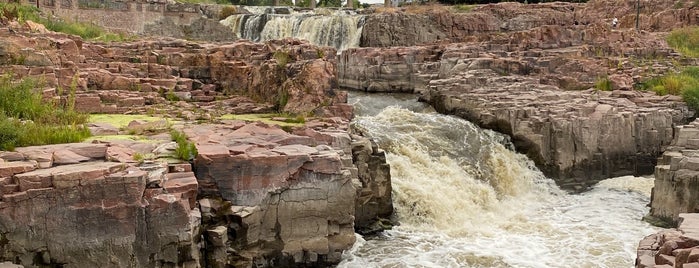 On the rocks at the falls at Sioux Falls is one of Tempat yang Disukai A.