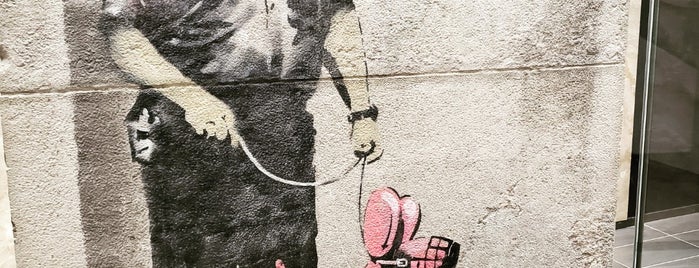 Guard with Balloon Dog (2010) by Banksy is one of To Do.