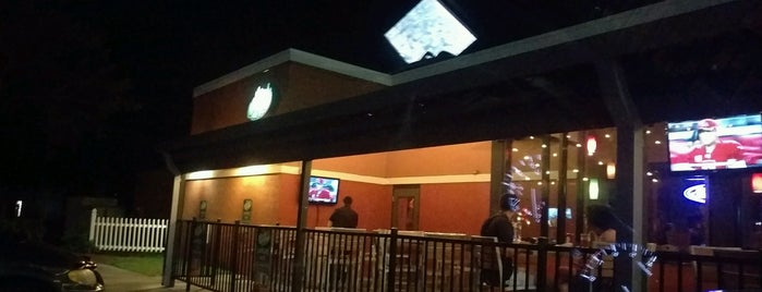 Applebee's Grill + Bar is one of Places we go.