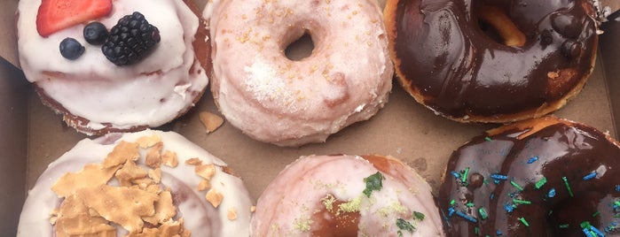 DISTRICT. Donuts. Sliders. Brew. is one of America's Best Donut Shops.