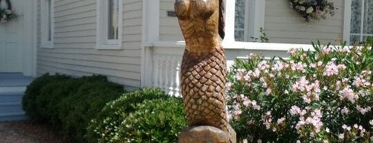 Mermaid Holding Clam Shell Tree Sculpture is one of Galveston Tree Sculptures.