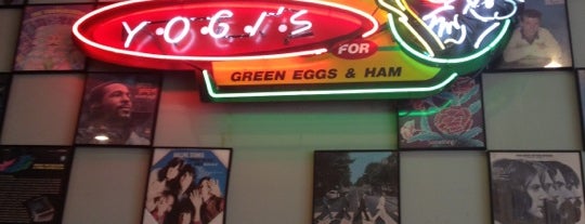Yogi's Deli and Grill is one of สถานที่ที่บันทึกไว้ของ Kat.