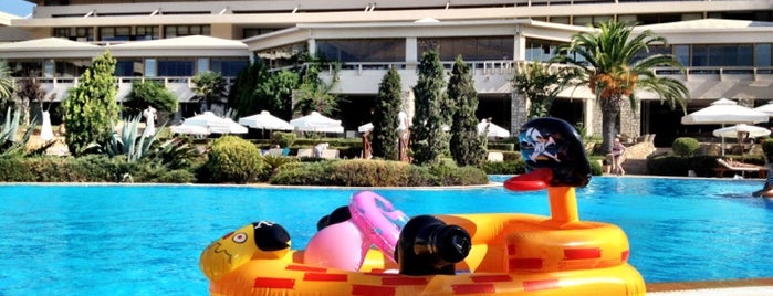 Pool at Sani Beach Hotel is one of Lugares favoritos de Oxana.