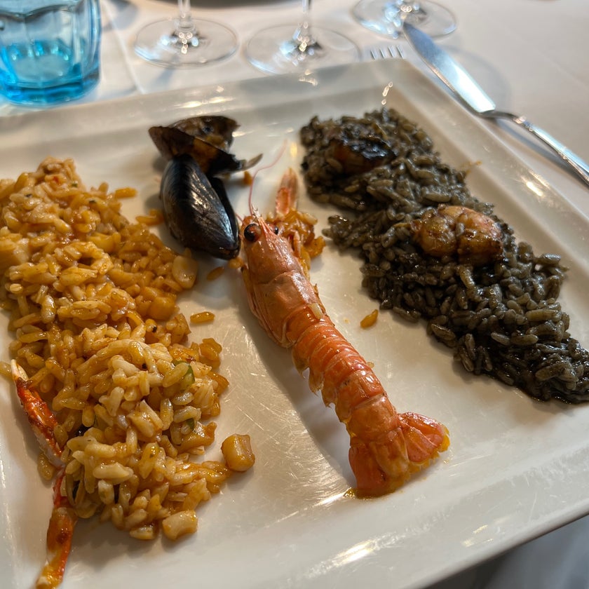 Can Majó - Seafood Restaurant,Paella Restaurant,Spanish - bar,desserts,scenic views,salads,well,lunch,healthy food,town,rice,beach,outdoor seating,dinner,crowded,trendy,good for dates,prints,paella,port,traditional cuisine,mousse,good for business meetings,good for special occasions,marinara,canoes,squid ink,hake,crayfish,beachside