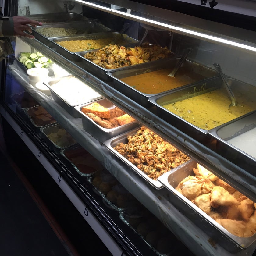 Punjabi Grocery & Deli - Deli,Fast Food Restaurant,Indian Restaurant,Indian,Grocery,Delis - coffee,inexpensive,well,lunch,town,rice,vegetarian food,park,city,spicy food,lines,dinner,chips,great value,small plates,snacks,onions,good for a late night,takeout,salsa,chai,spinach,yogurt,roti,taxis,good for a quick meal,stew,fresh made,samosas,lentils,cilantro,chickpeas,tangy,saag,chole,spicy peppers