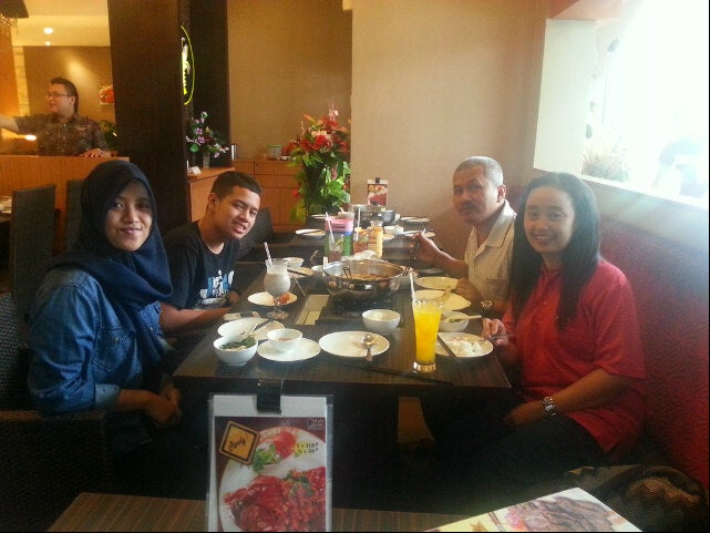 X. O Suri & Grill Logo