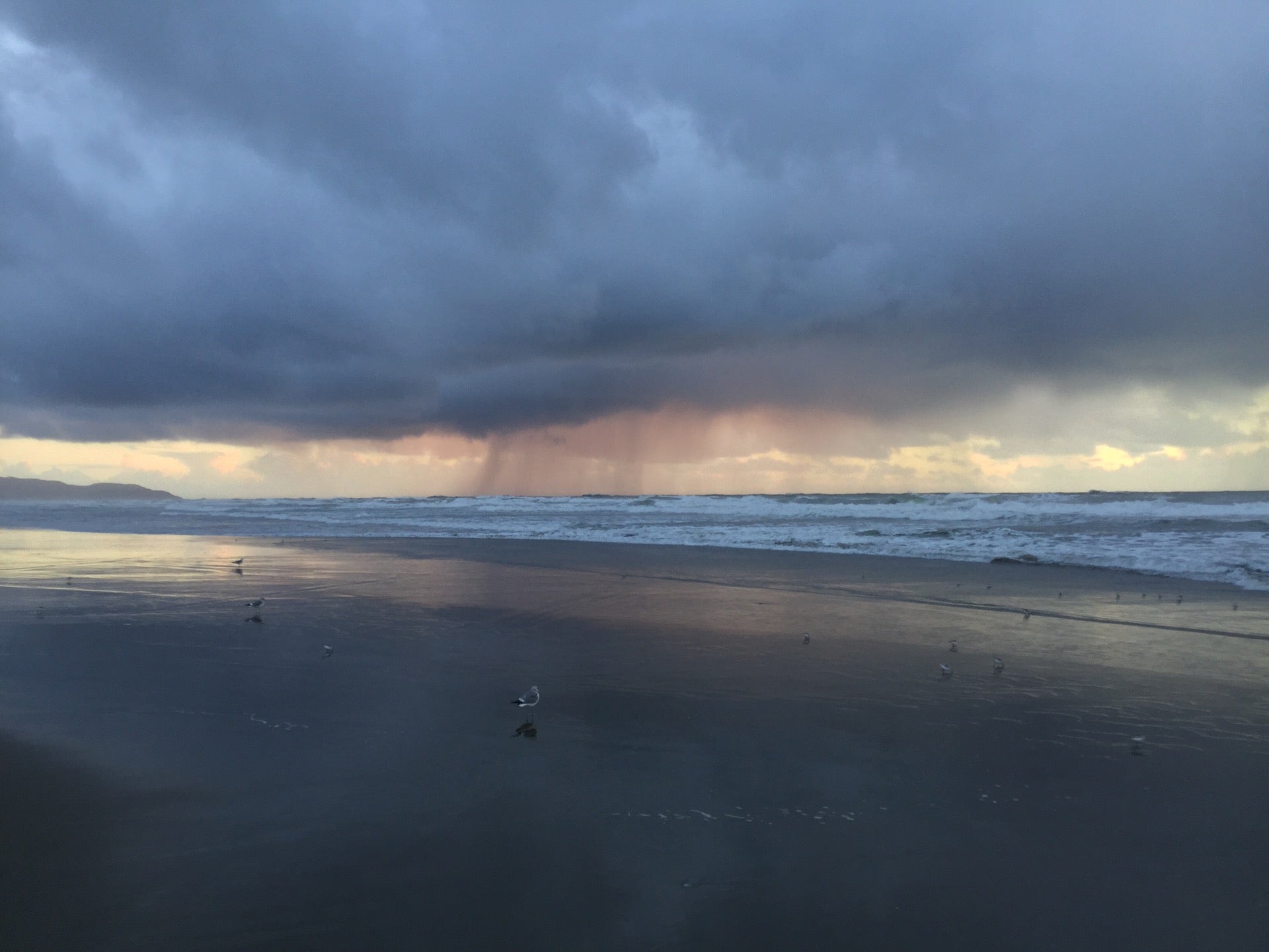 Dramatic Clouds Last Night At Ocean Beach No Sign Of The Setting Sun Except A Distant Orange Glow Under The Clouds Above The Ocean Lighting Up Strands Of Rain Returning To