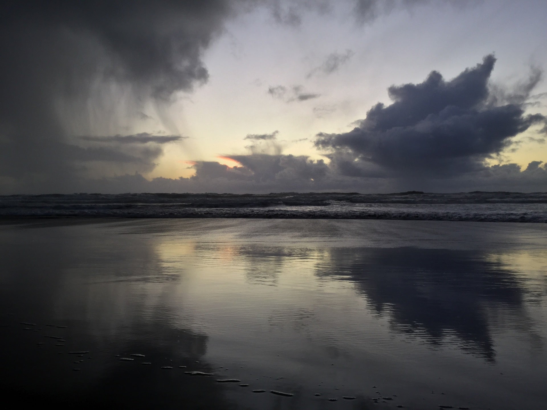 Dramatic Clouds Last Night At Ocean Beach No Sign Of The Setting Sun Except A Distant Orange Glow Under The Clouds Above The Ocean Lighting Up Strands Of Rain Returning To