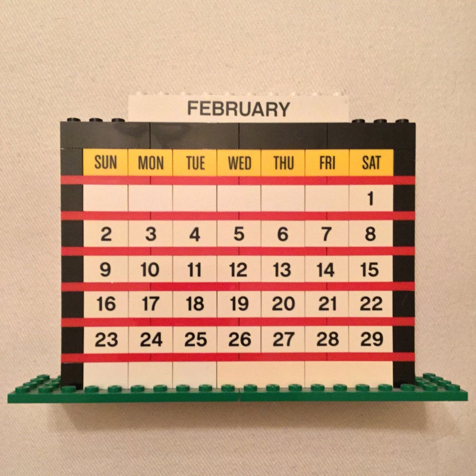 February of 2020 month calendar built from LEGO bricks, on an off-white background.