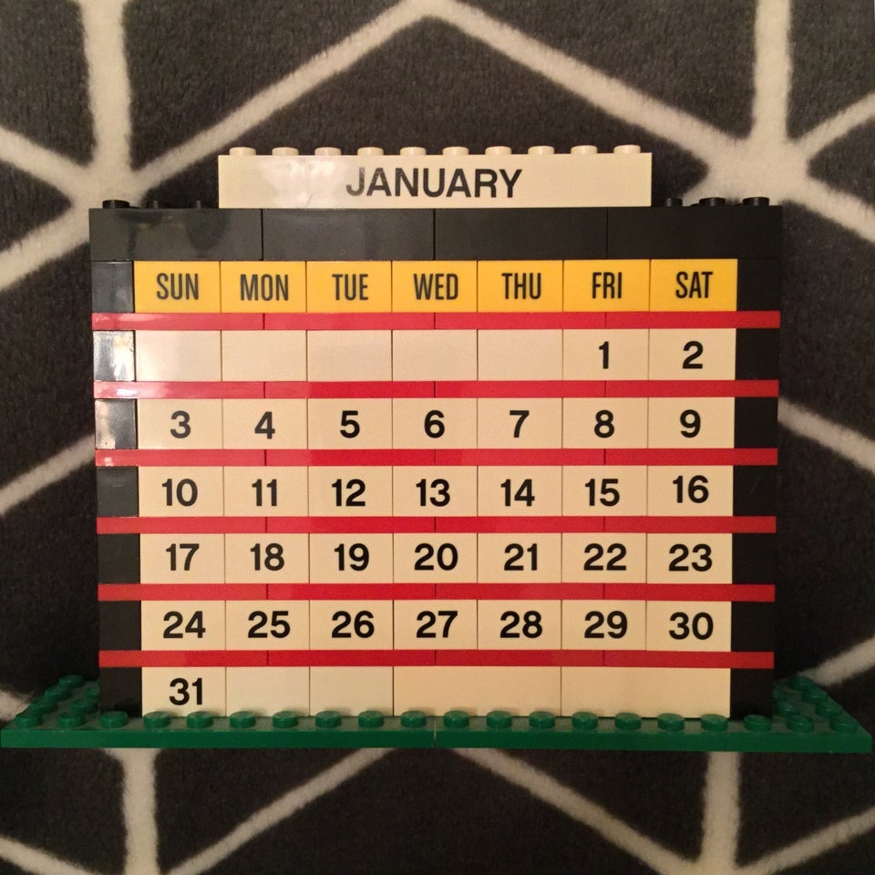 January of 2021 month calendar built from LEGO bricks, on a hexagonal white on gray blanket background.