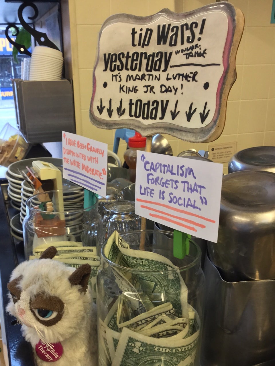 Tip jars at Haight Street Market Cafe for Martin Luther King Junior’s birthday with two quotes from him.